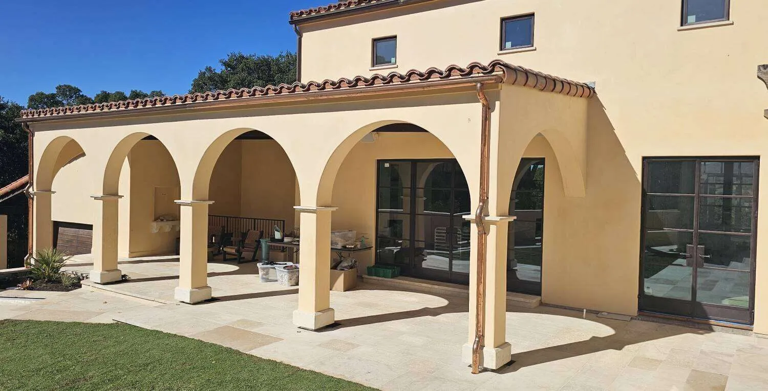 Mediterranean-style home with stucco exterior and arches in Saint Helena.
