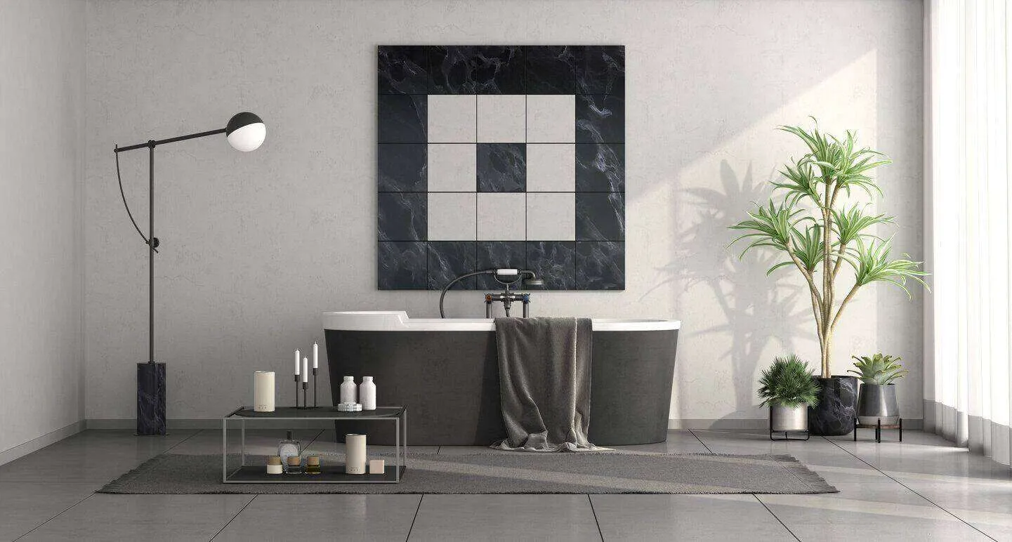 Minimalist black and white bathroom with freestanding tub, geometric wall art, and modern decor.
