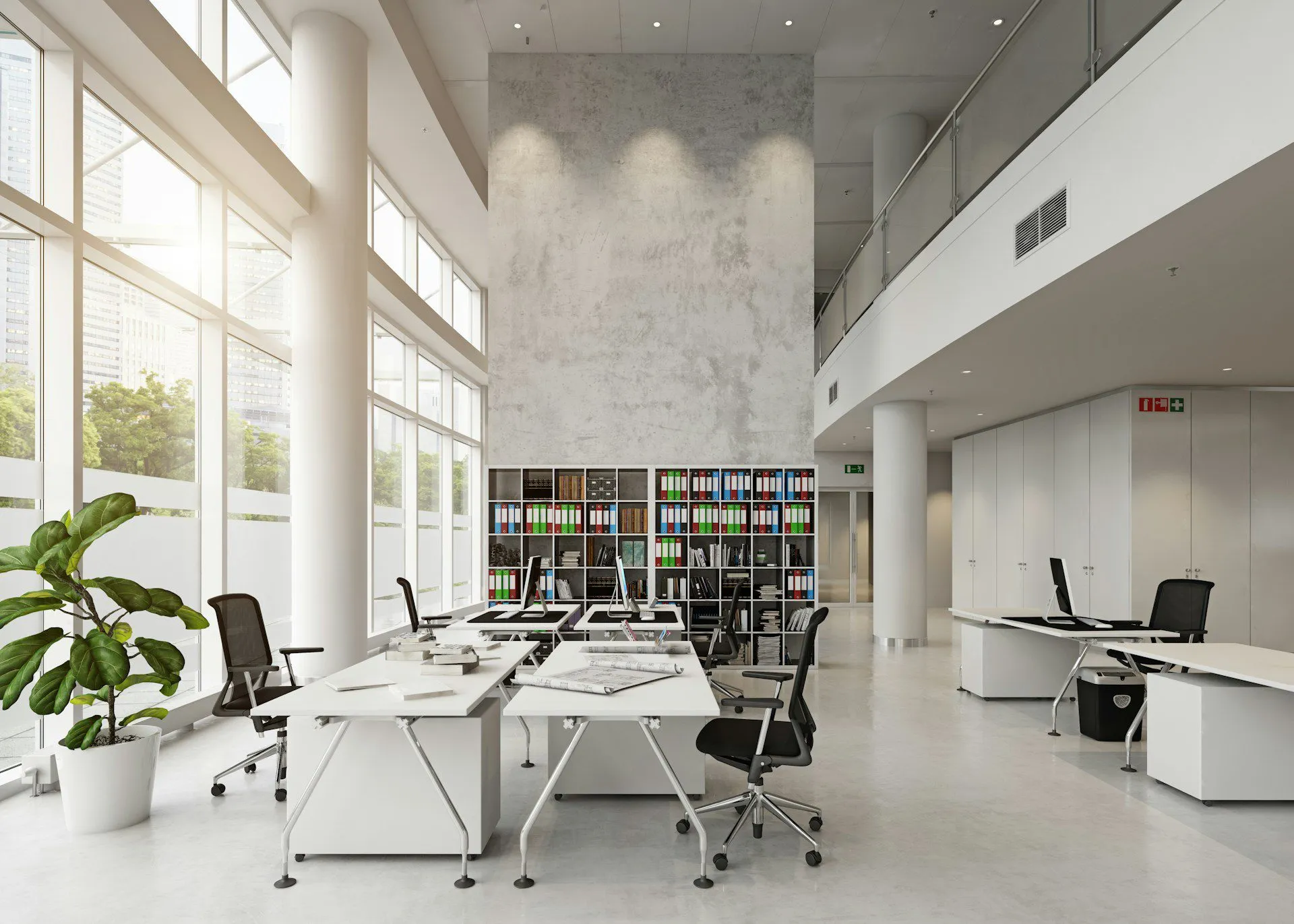 Spacious modern office with large windows, desks, chairs, and a bookshelf.