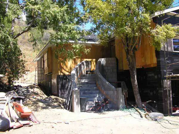 Partially built stucco home with curved staircase at a construction site in Greenbrae. — Sausalito area