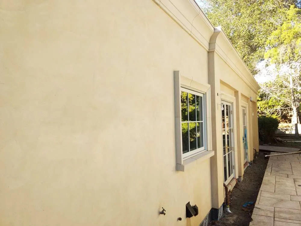Exterior view of a residential building with smooth stucco finish and windows, located in Hillsborough. — Santa Rosa area