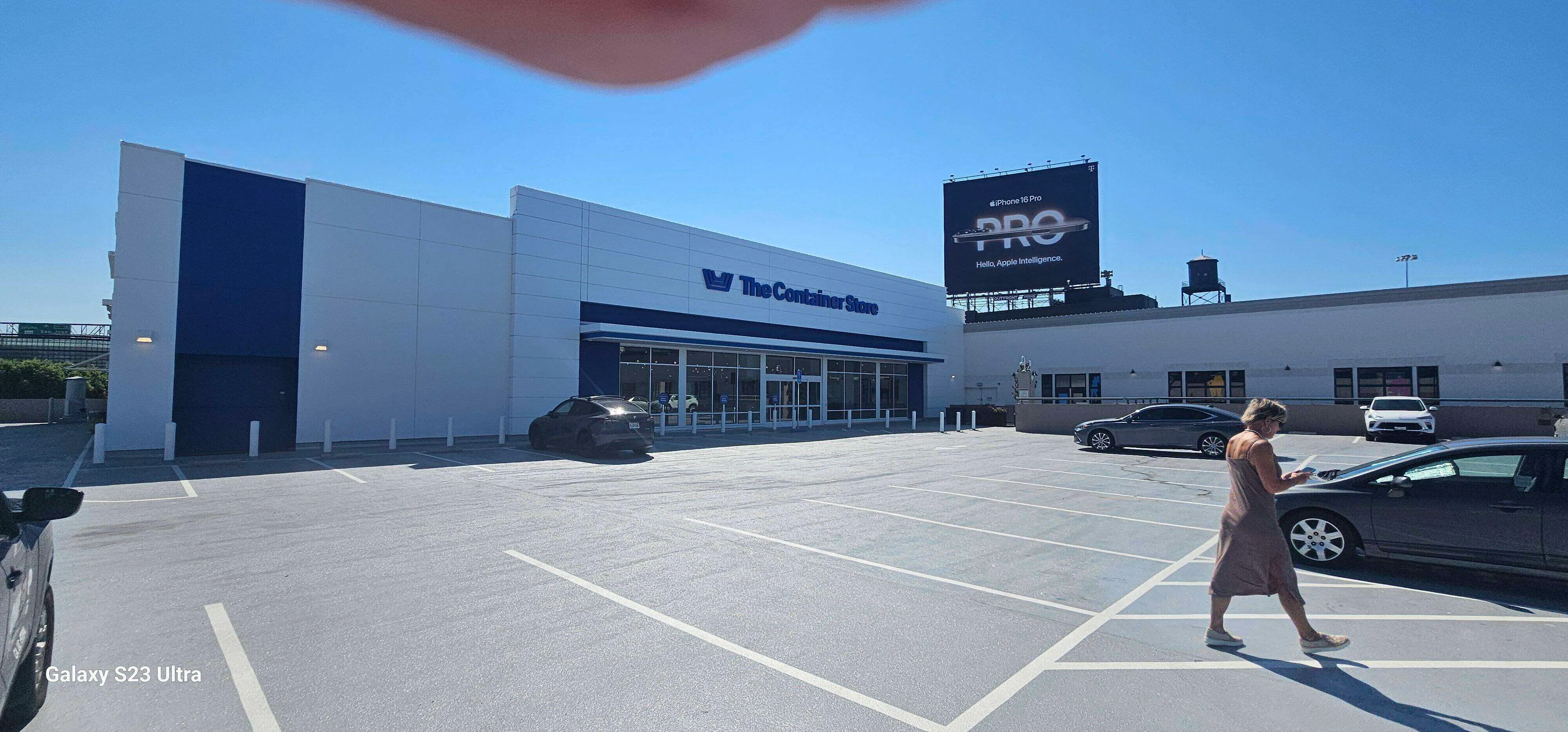 Exterior view of The Container Store with EIFS facade and parking lot. — Ross area