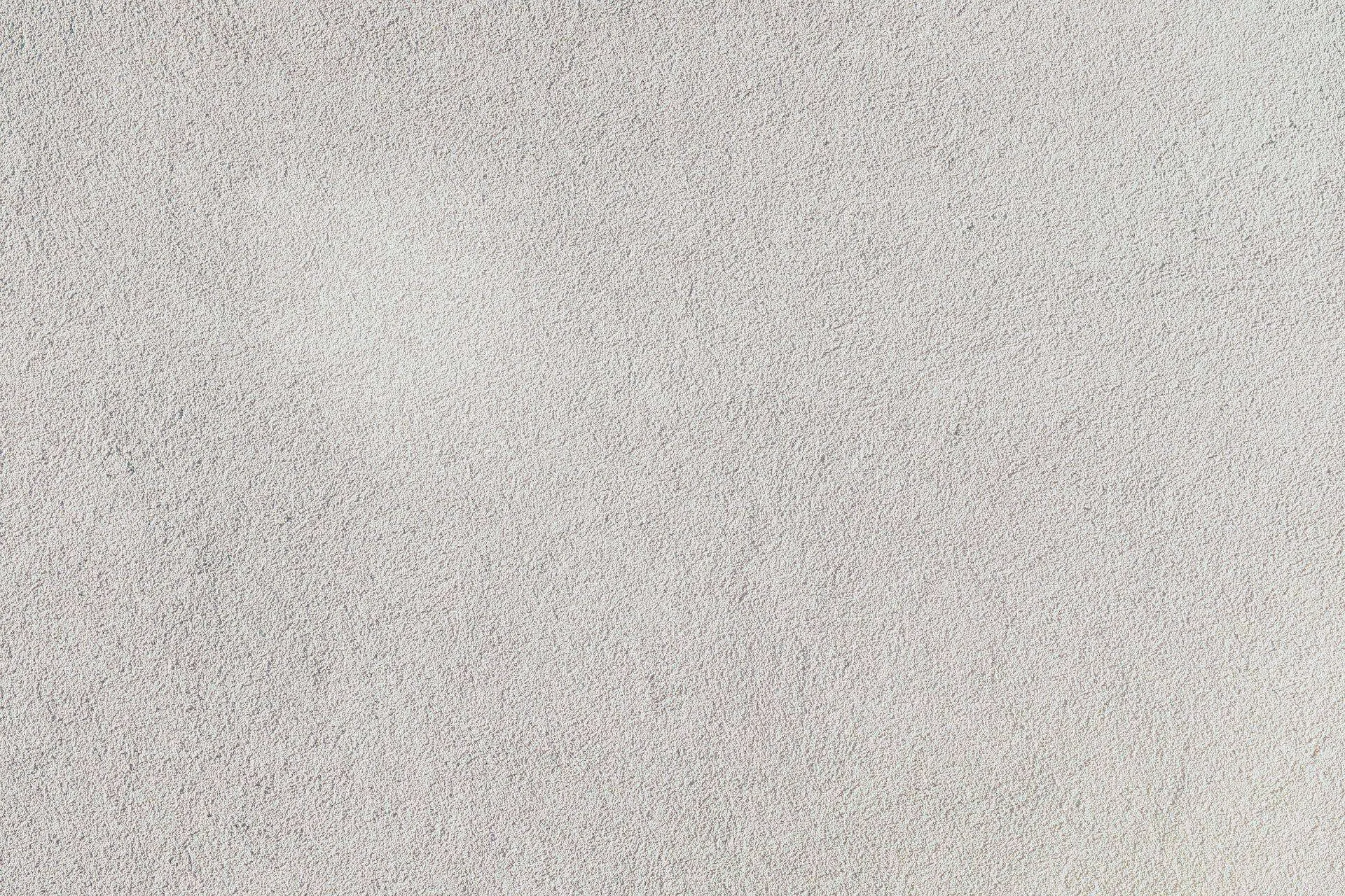 Close-up view of a textured plaster wall surface with a consistent pattern. — Ross area