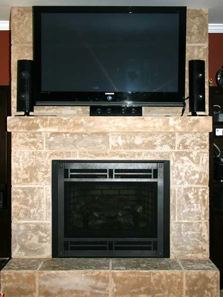 Televesion and Speaker Above the Fireplace